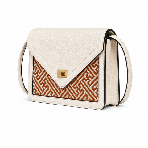 Ivory Atelier luxury bamboo leather handbag in ivory leather with geometric woven bamboo front panel, showcasing refined artisan craftsmanship.