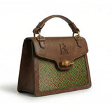Heritage Arc bamboo leather handbag three-quarter view highlighting woven bamboo panel and leather structure