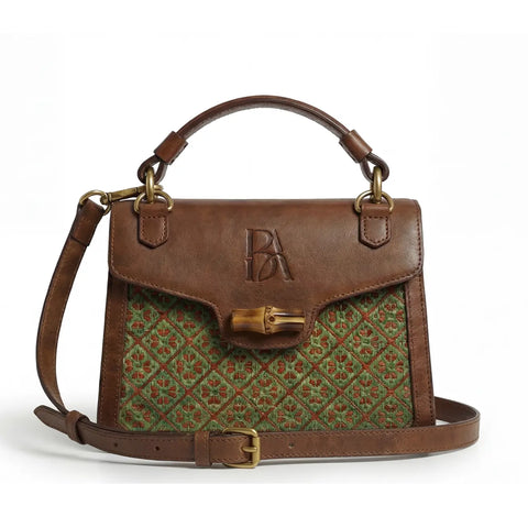 Front view of Heritage Arc structured bamboo leather handbag with top handle and flap detail