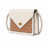 Ivory Atelier luxury bamboo leather handbag in ivory leather with geometric woven bamboo front panel, showcasing refined artisan craftsmanship.