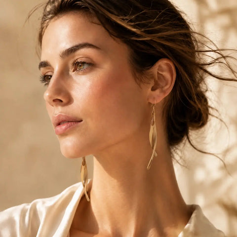 Model wearing Bamboura Wind Chimes lightweight bamboo drop earrings