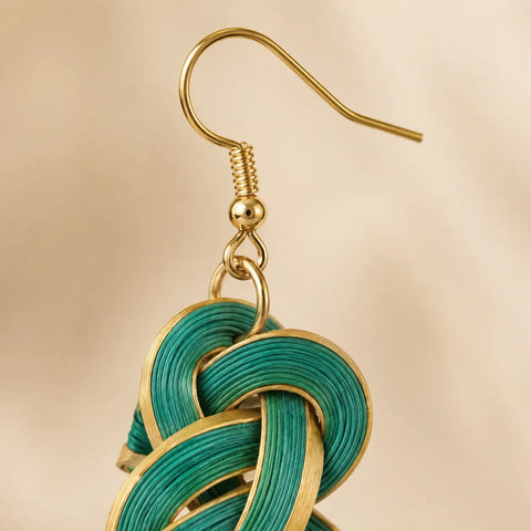 Close-up of Tidal Bloom handwoven bamboo spiral earrings
