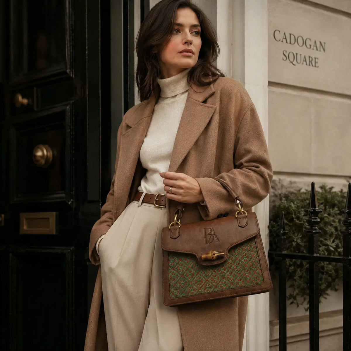 Heritage Arc bamboo leather handbag styled in quiet luxury city lifestyle with refined natural textures