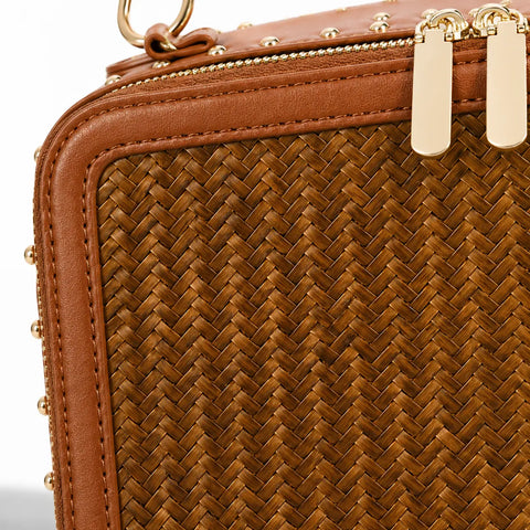 Close-up of Regent Weave handwoven bamboo texture with leather trim and gold zipper details
