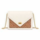 Bamboura Ivory Atelier ivory leather crossbody handbag with gold chain strap and woven bamboo front panel, designed for timeless everyday elegance.