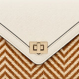 Close-up detail of Ivory Atelier bamboo leather handbag featuring premium ivory leather texture, gold clasp and intricate handwoven bamboo pattern.