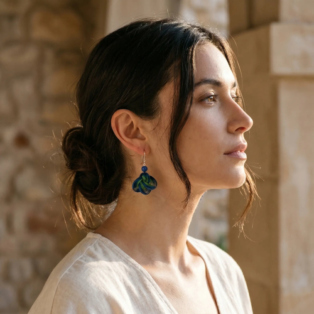 Ocean Whispers handwoven bamboo earrings styled with linen and soft tailoring